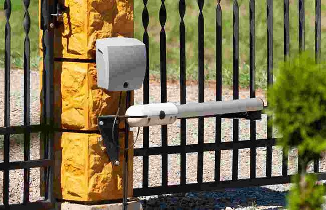 Automated electric gate with motorized arm for secure entry access.